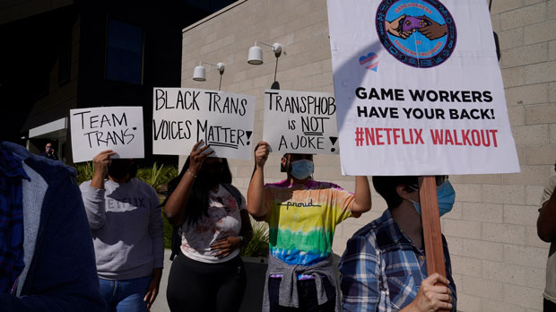 People protest outside the Netflix building in the Hollywood section of Los Angeles, Wednesday, Oct. 20, 2021. Critics and supporters of Dave Chappelle's Netflix special and its anti-transgender comments gathered outside the company's offices Wednesday. (AP Photo/Damian Dovarganes)