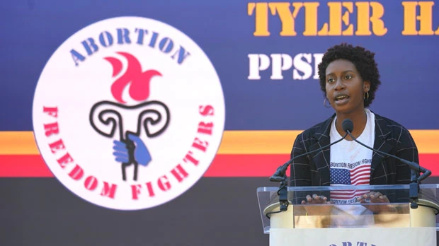 The Mississippi director for Planned Parenthood Southeast, Tyler Harden, tells an audience of reproductive rights supporters that efforts to limit abortion access are "just another form of oppression" for women of color, at a rally in Smith Park Jackson, Miss., on Dec. 1, 2021. (AP Photo/Rogelio V. Solis)