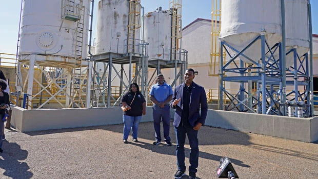 FILE - EPA Administrator Michael Regan, right, speaks to reporters at the O.B. Curtis Water Treatment Plant, a Ridgeland based facility near Jackson, Miss., about longstanding water issues that have plagued the city, on Nov. 15, 2021. The Environmental Protection Agency is taking a series of enforcement actions to address air pollution, unsafe drinking water and other problems in minority communities in three Gulf Coast states that Administrator Michael Regan visited as part of a "Journey to Justice" tour last fall.(AP Photo/Rogelio V. Solis, File)