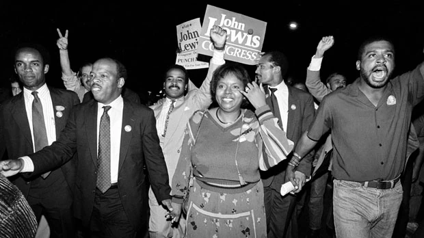 John Lewis, left, and his wife, Lillian, lead a march of supporters