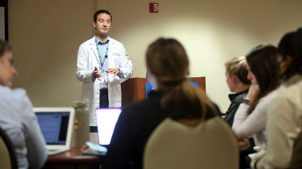 Dr. Keith Reisinger-Kindle, associate director of the OB-GYN residency program at Wright State University's medical school in Dayton, Ohio, leads a lecture of OB-GYN residents in the Wright State program Wednesday, April 13, 2022. The physician created and implemented abortion coursework for medical students and residents, with support from his university, and offers training at a nearby clinic where he also performs abortions. (AP Photo/Paul Vernon)