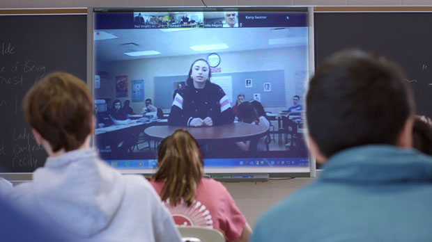 In this image provided by JTwo Films, Grace Narkum, a student from Hubbard High School in Hubbard, Ohio, and her classmates participate in a National Constitution Center Peer-to-Peer Exchange with students from Radnor High School in Wayne, Pa., in March 2019. (National Constitution Center/JTwo Films via AP)