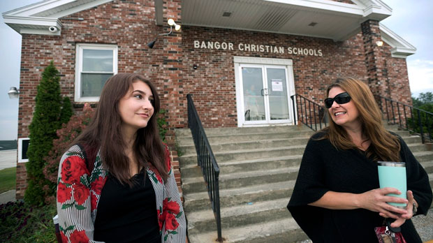 Bangor Christian Schools sophomore Olivia Carson, 15, of Glenburn, Maine, left, stands with her mother Amy