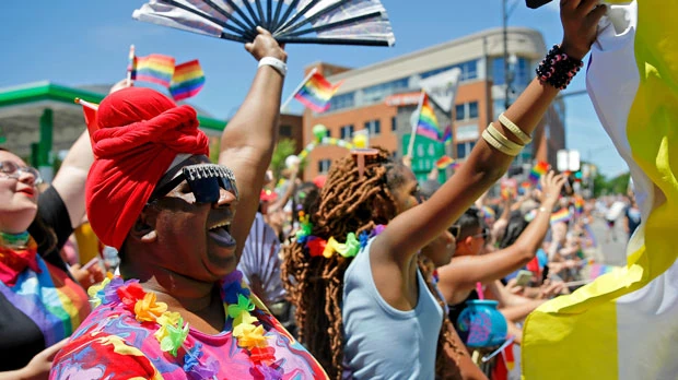 Participants cheer during the 51st Chicago Pride Parade in Chicago, Sunday, June 26, 2022. (AP Photo/Jon Durr)