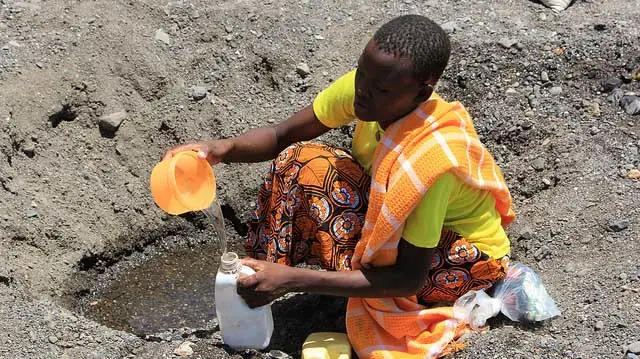"Digging for drinking water in a dry riverbed" by DFID - UK Department for International Development licensed under CC BY 2.0