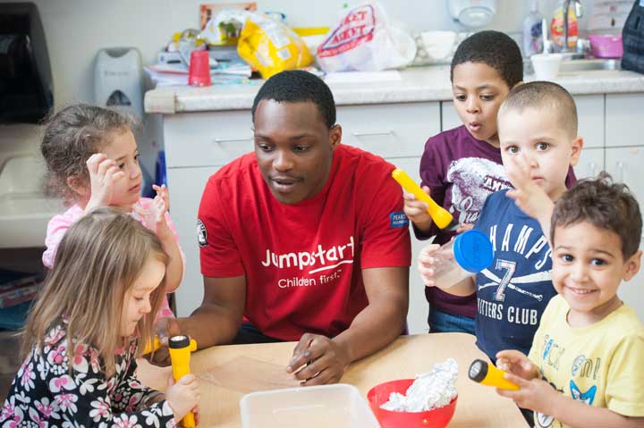 Jumpstart Volunteer working with kids. Photo Courtesy of: Jumpstart