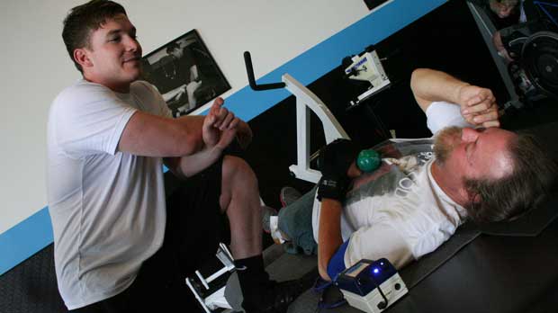 "Client and physical therapists doing rehabilitation work at the gym" Photo courtesy of NeuAbility