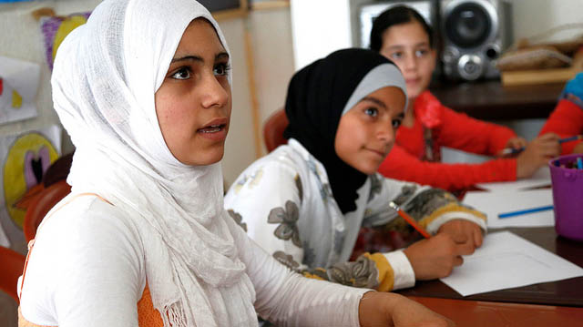 "Teenage Syrian girls take part in a discussion about children's rights, at a community centre in Lebanon" by DFID - UK Department for International Development licensed under CC BY 2.0 