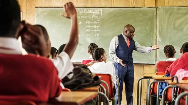 Students with teacher in class