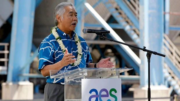 Hawaii Gov. David Ice speaks at the AES Corporation's coal-fired power plant in Kapolei, Hawaii during a ceremony to mark the closure of the facility, Thursday, Aug. 18, 2022. As Hawaii transitions toward its goal of achieving 100% renewable energy by 2045, the state's last coal-fired power plant closed this week ahead of a state law that bans the use of coal as a source of electricity beginning in 2023. (AP Photo/Caleb Jones)