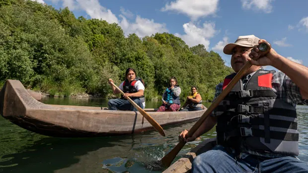 Yurok tribal members lead a redwood canoe tour on the lower Klamath River