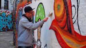 "graffiti artist" by zoetnet licensed under CC BY 2.0