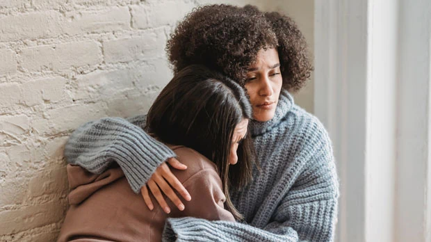 Photo by Liza Summer: https://www.pexels.com/photo/sad-multiracial-women-hugging-at-home-6382659/