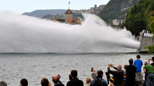 People watch a huge water jet