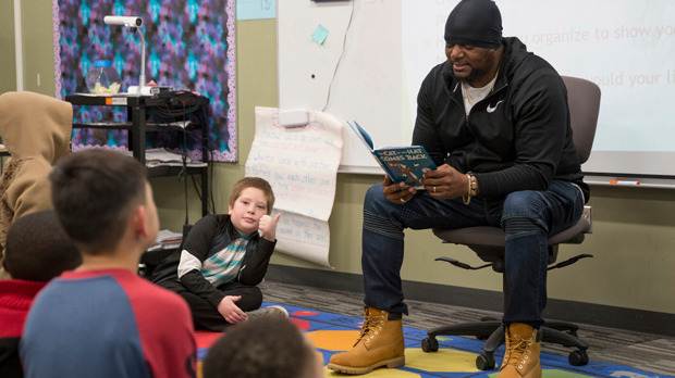 Will Keeps reads a Dr. Seuss story to students at Lovejoy Elementary School in Des Moines, Iowa