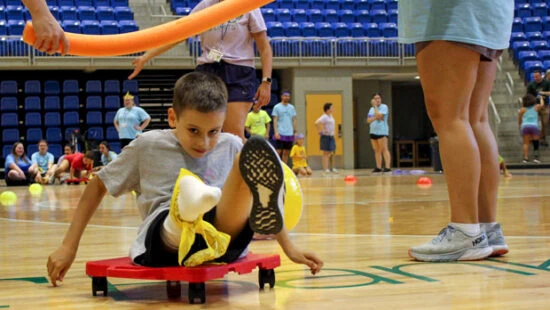 Child participates in an obstacle course